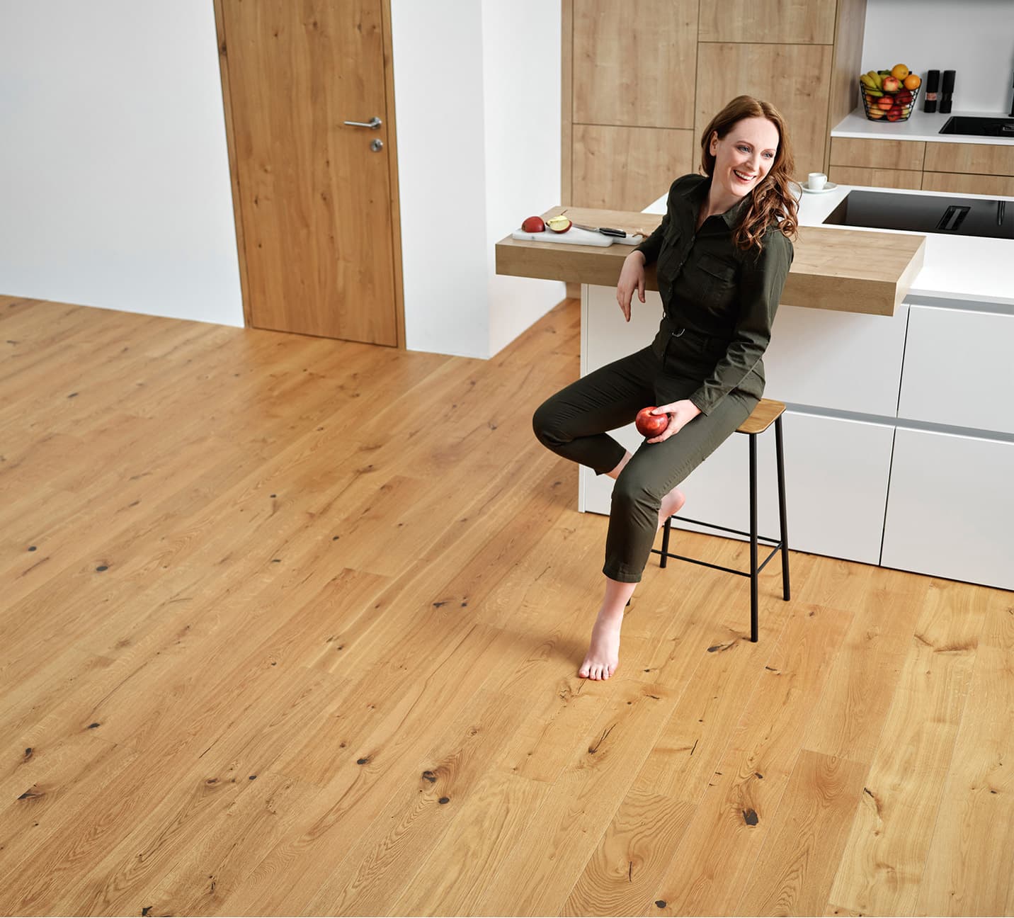 Wide oak plank flooring boards laid in long parallel runs