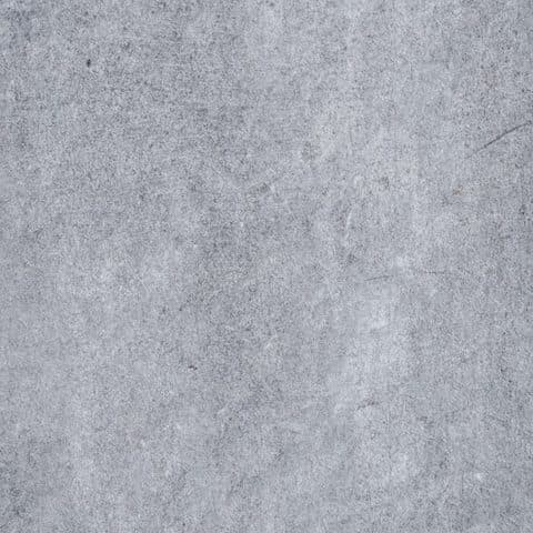Grey micro-cement effect porcelain surface with a fine mottled grain