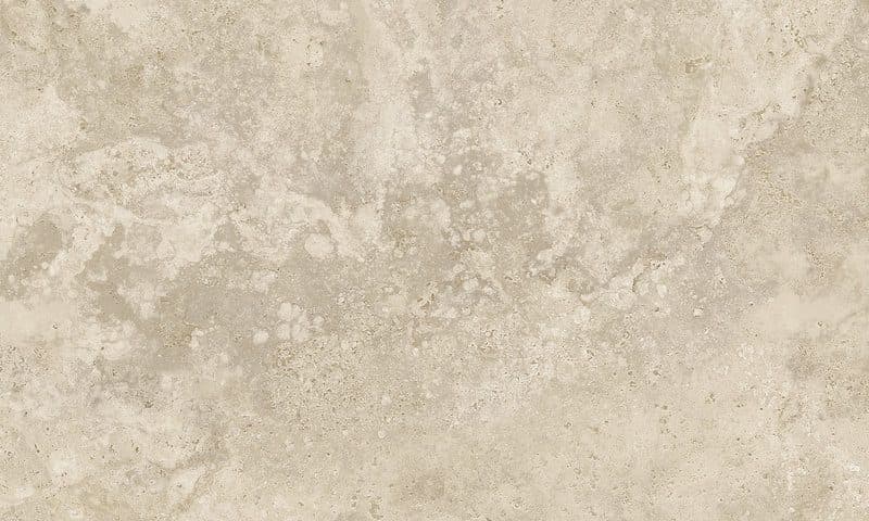 Close crop of a warm beige travertine surface, cloudy and finely pitted