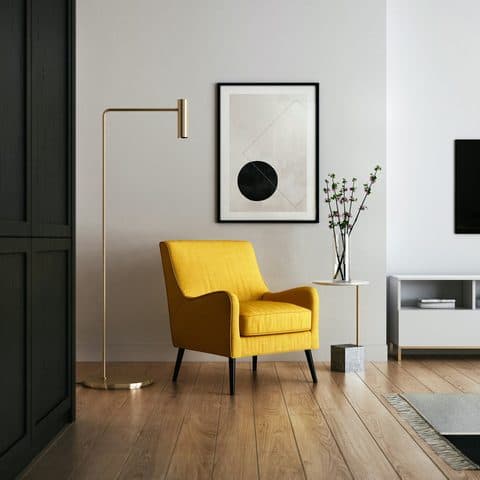 Slatted oak console against a dark green wall, with a brass floor lamp and a yellow armchair